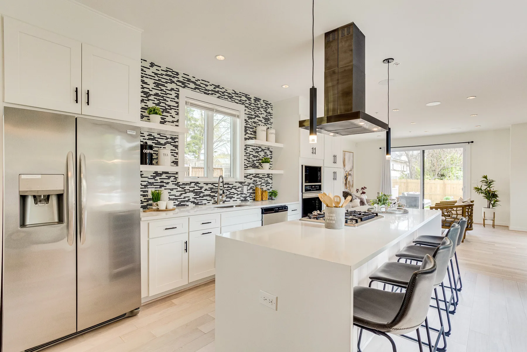 Light-filled kitchen with a central island and warm wood finishes